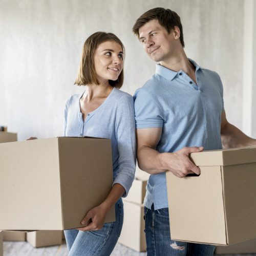 couple-holding-boxes-for-moving-out-day